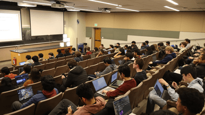 many people seated in a classroom